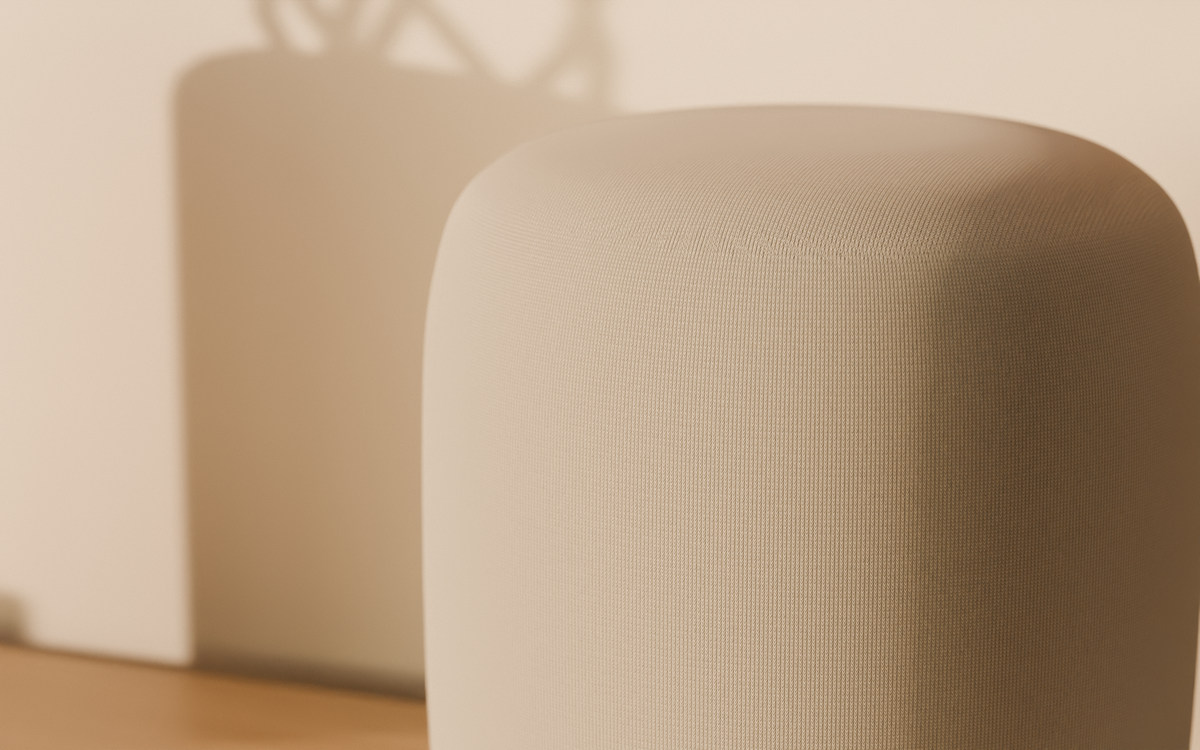 The warp-knit textile of aaro one in Pearl where the side curves into the crown, in low evening sun