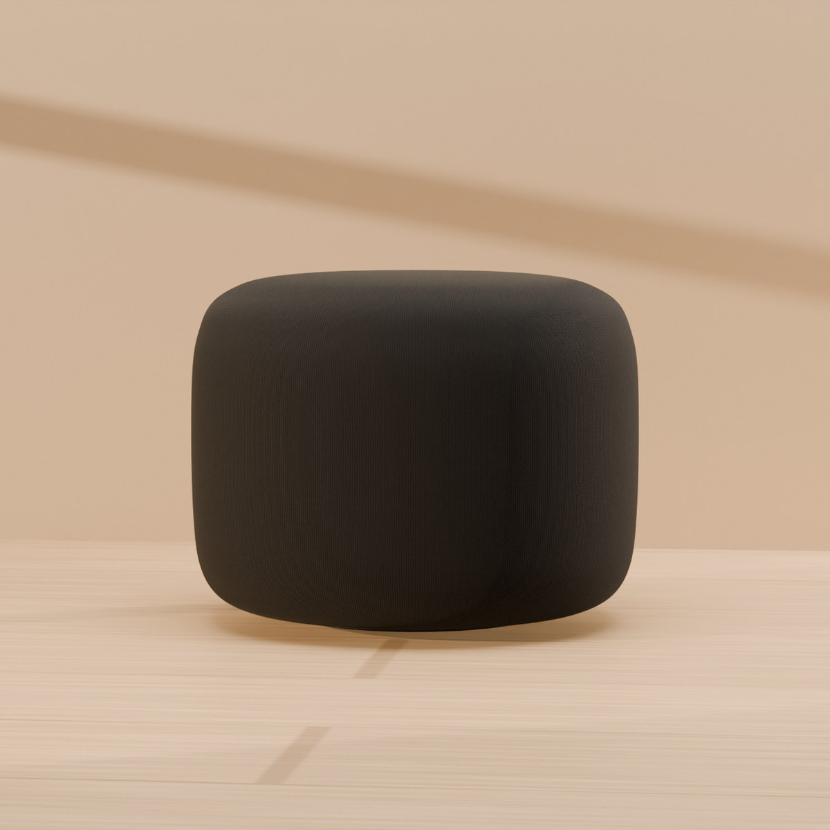aaro sub in Graphite on an oak floor in low sun